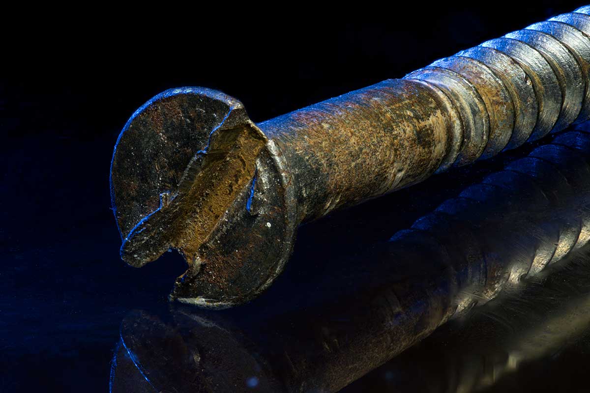 rusty screw photo with refection