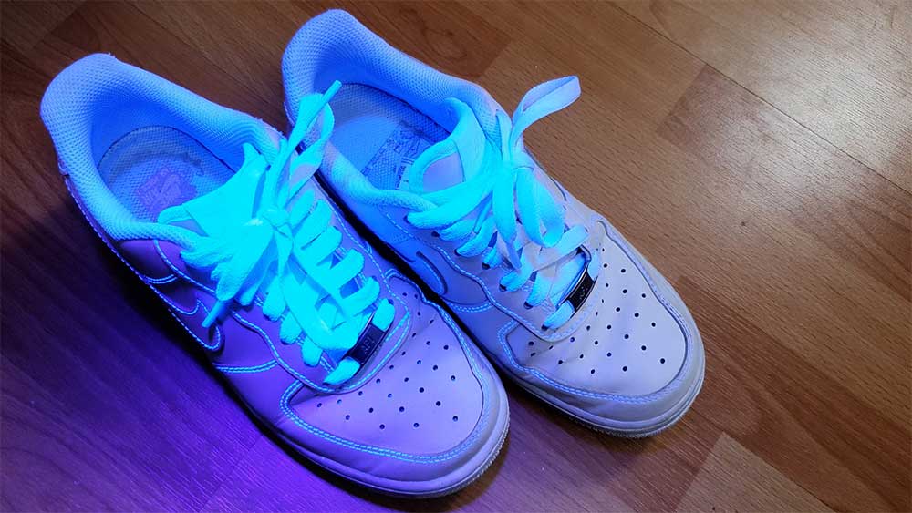 Shoes glowing in UV light