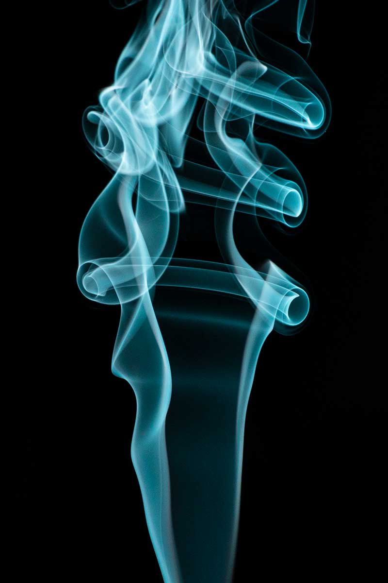 blue smoke photography on a black background