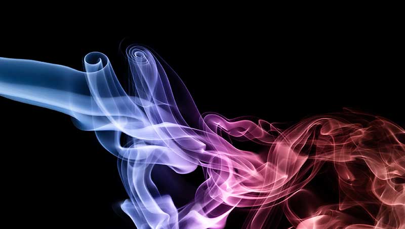 coloured red and blue smoke on black