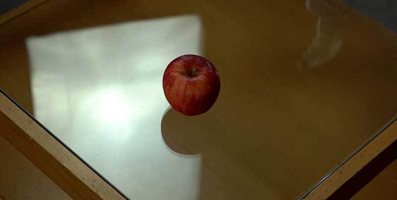 apple-on-glass-surface